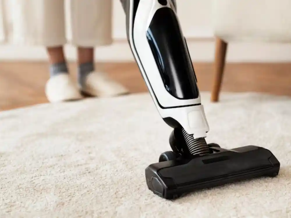 Carpet extraction wand in use on wet carpet, or carpet pulled back with drying equipment — Carpet Water Damage Restoration in Fairfax, VA