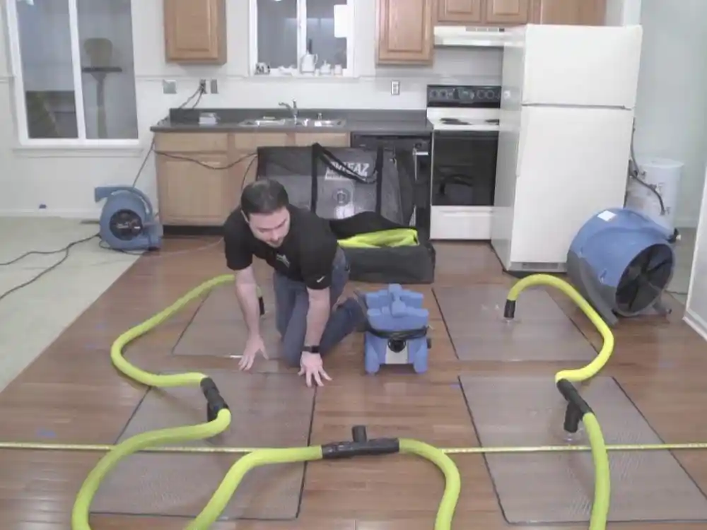 Specialized hardwood drying mats or injection drying system laid across an affected — Hardwood Floor Water Damage Restoration in Fairfax, VA
